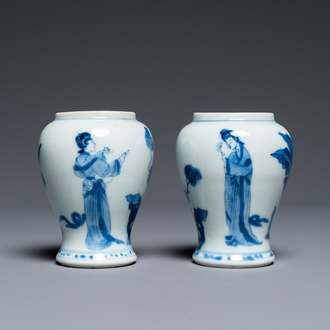 A pair of Chinese blue and white small vases with ladies, Kangxi