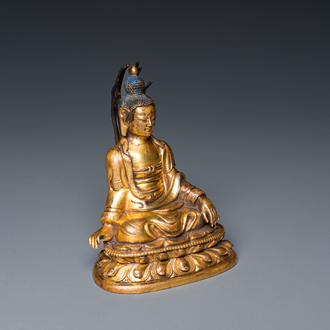 A small Sino-Tibetan gilt bronze Buddha, 19th C.