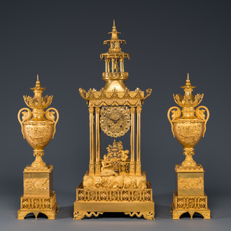 An impressive three-piece gilt bronze chinoiserie clock garniture, France, 19th C.