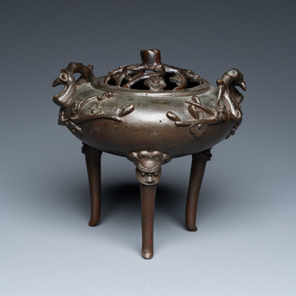 A Chinese bronze tripod censer and cover, 19th C.