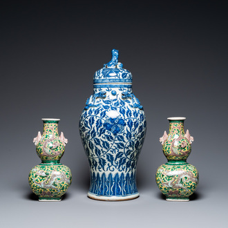 A pair of Chinese famille verte double gourd vases and a blue and white vase and cover, 19/20th C.