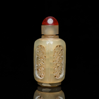 A Chinese reticulated and movable celadon jade snuff bottle, Qing