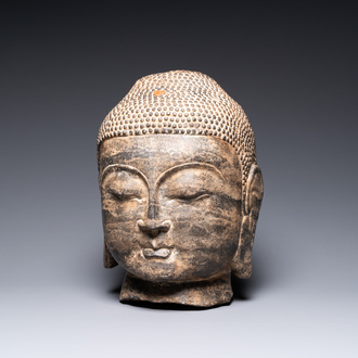 A Chinese Ming-style carved stone head of Buddha, 19/20th C.