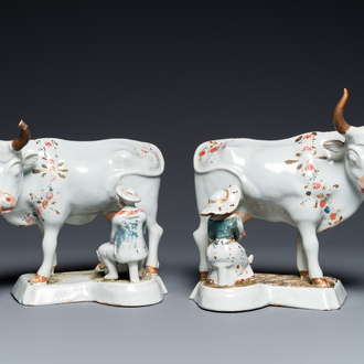 A pair of cold-painted white Dutch Delft cow milkers' groups, 18th C.