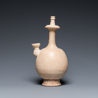 A Chinese cream-white-glazed stoneware kundika, probably Tang