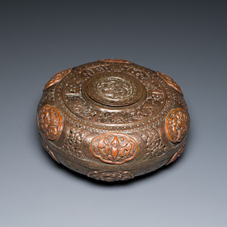 A Tibetan pierced and repoussé copper scent box and cover with inscribed mantra, 18/19th C.