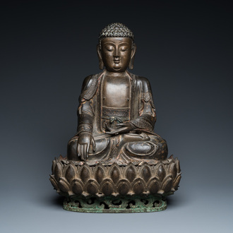 A large Sino-Tibetan gilt bronze Buddha on lotus throne, Ming