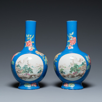 A pair of Chinese blue-ground famille rose vases, He Xuren 何許人 seal mark, 20th C.