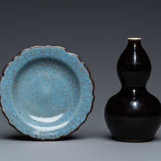 A small Chinese black-glazed double gourd vase and a blue crackle-glazed saucer dish, Qing