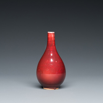 A small Chinese sang-de-boeuf-glazed bottle vase, Xuande mark, Qing