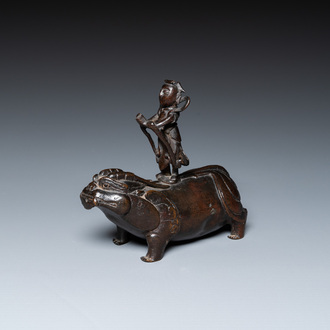 A Chinese bronze waterdropper in the shape of a bixi with rider, Ming