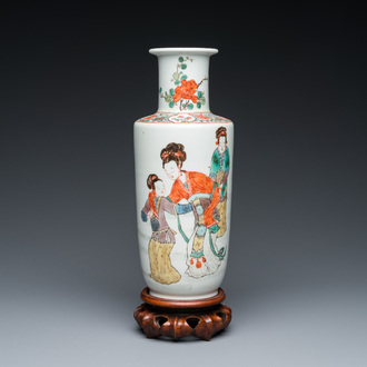 A Chinese famille verte rouleau vase on wooden 'lotus' stand, probably 19th C.