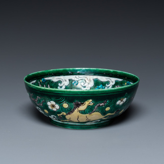 A Chinese verte biscuit 'galloping horses' bowl, Qing