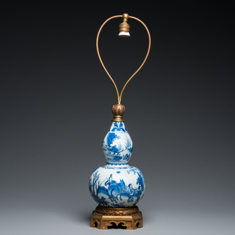 A Chinese blue and white double gourd vase mounted as a lamp, Transitional period