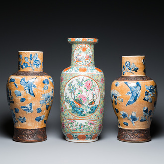 A Chinese Canton famille rose rouleau vase and a pair of Nanking vases, 19th C.