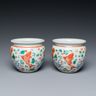 A pair of small Chinese wucai 'carps' jardinières, 19th C.