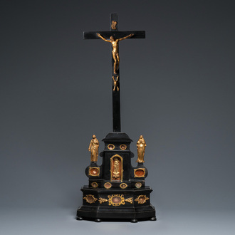 An ebonised wooden reliquary crucifix with gilt bronze corpus, Germany or Italy, 17/18th C.