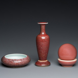 A Chinese monochrome copper-red box, a peachbloom-glazed vase on stand and a brush washer, Kangxi and Yongzheng marks, 19/20th C.