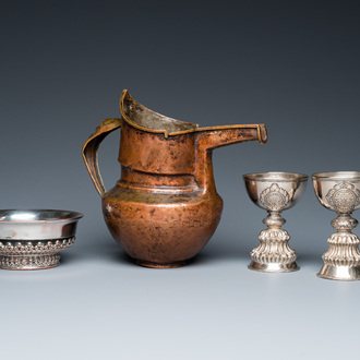 Two Tibetan silver stem bowls, a silvered bowl and a copper 'sengmaohu' ewer, 17/19th C.