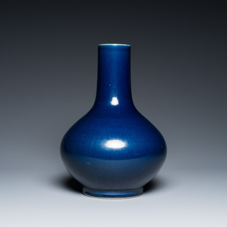 A Chinese monochrome 'sacrificial blue' bottle vase, 18/19th C.