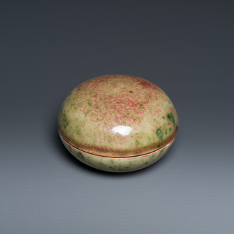 A Chinese peachbloom-glazed seal paste box, Kangxi mark, 19th C.