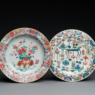 A Chinese famille verte 'antiquities' plate and a famille rose 'flower basket' plate, Kangxi and Qianlong
