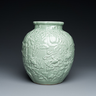 A Chinese relief-molded monochrome celadon-glazed vase, 19/20th C.