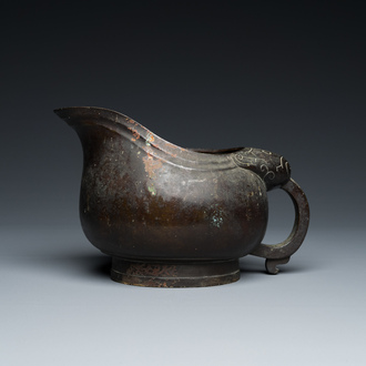 A rare Chinese inscribed archaistic bronze 'Yi' pouring vessel, Zhenghe, Northern Song