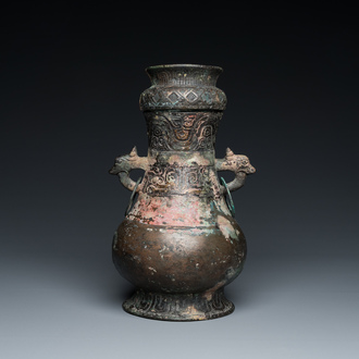 A Chinese ritual bronze 'hu' wine vessel and cover, Eastern Zhou or earlier