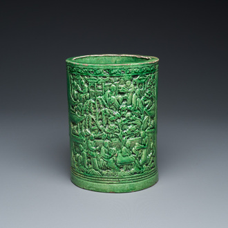 A Chinese monochrome green-glazed relief-molded brush pot, 19th C.