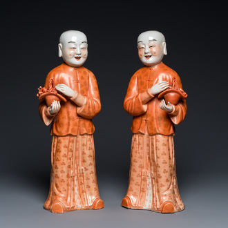 A pair of Chinese coral red 'Hehe Er Xian' sculptures, probably Jiaqing