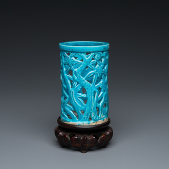 A Chinese reticulated monochrome turquoise brush pot on wooden stand, Qing