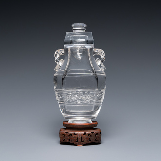 A Chinese rock crystal covered vase on wooden stand, 19/20th C.