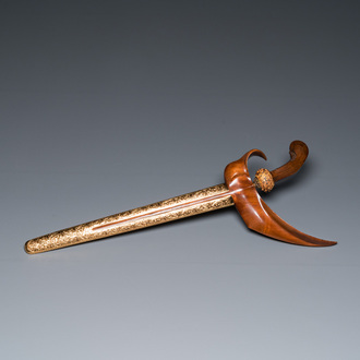 An Indonesian 'kris' or 'keris' dagger in polished Javanese wood with gold, gilt silver and precious stones, 19th C.