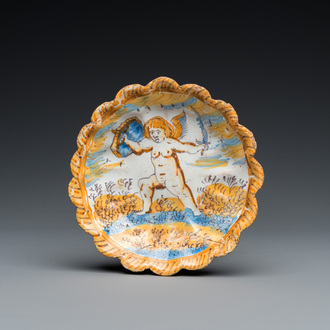 A small polychrome maiolica dish with a fighting putto, Verstraeten workshop, Haarlem, 17th C.