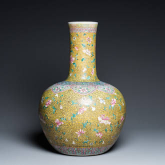 A large Chinese famille rose yellow-ground bottle vase, Qianlong mark, 19th C.