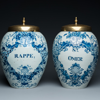 A pair of Dutch Delft blue and white tobacco jars with brass lids, 18th C.