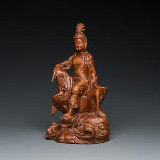 A Chinese wood sculpture of the seated Tara, 19th C.