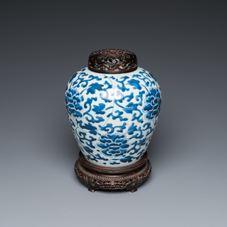 A Chinese blue and white vase with floral scrolls, Transitional period