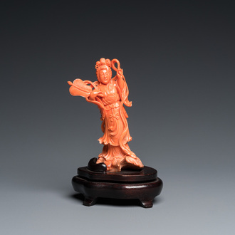 A Chinese red coral carving of Guanyin with a fan, 19/20th C.