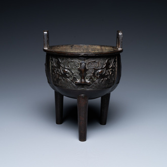 A Chinese bronze tripod censer with 'taotie' masks, Ming