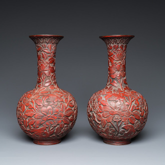 A pair of Chinese red cinnabar lacquer bottle vases, 19/20th C.