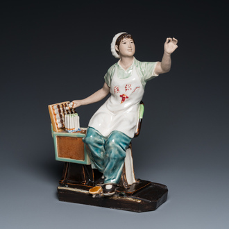 A Chinese Cultural Revolution figure of a cotton weaver, ca. 1970