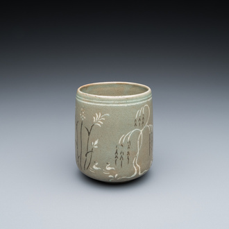 A Korean slip-decorated celadon-ground tea cup