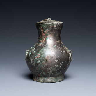 A Chinese bronze 'hu' vase and cover, Han