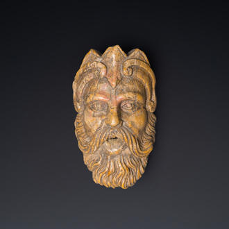 An Italian red marble 'Neptune' fountain head, 17/18th C.