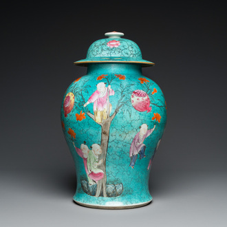 A Chinese turquoise-ground famille rose 'boys at a pomegranate tree' vase and cover, 19th C.