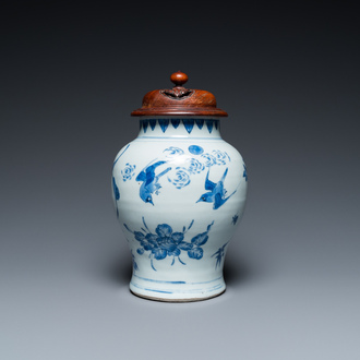 A Chinese blue and white vase with birds among blossoming branches, Transitional period