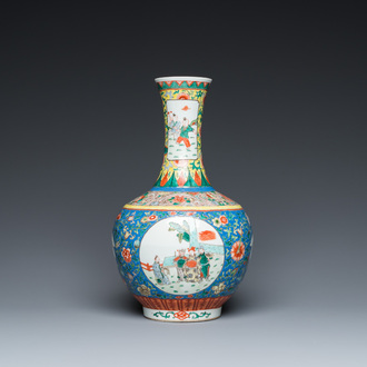 A Chinese famille verte bottle vase, Kangxi mark, 19/20th C.