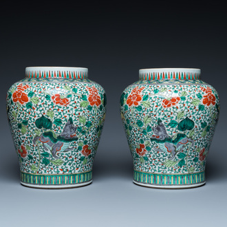 A pair of Chinese famille verte 'Buddhist lions' vases, 19th C.